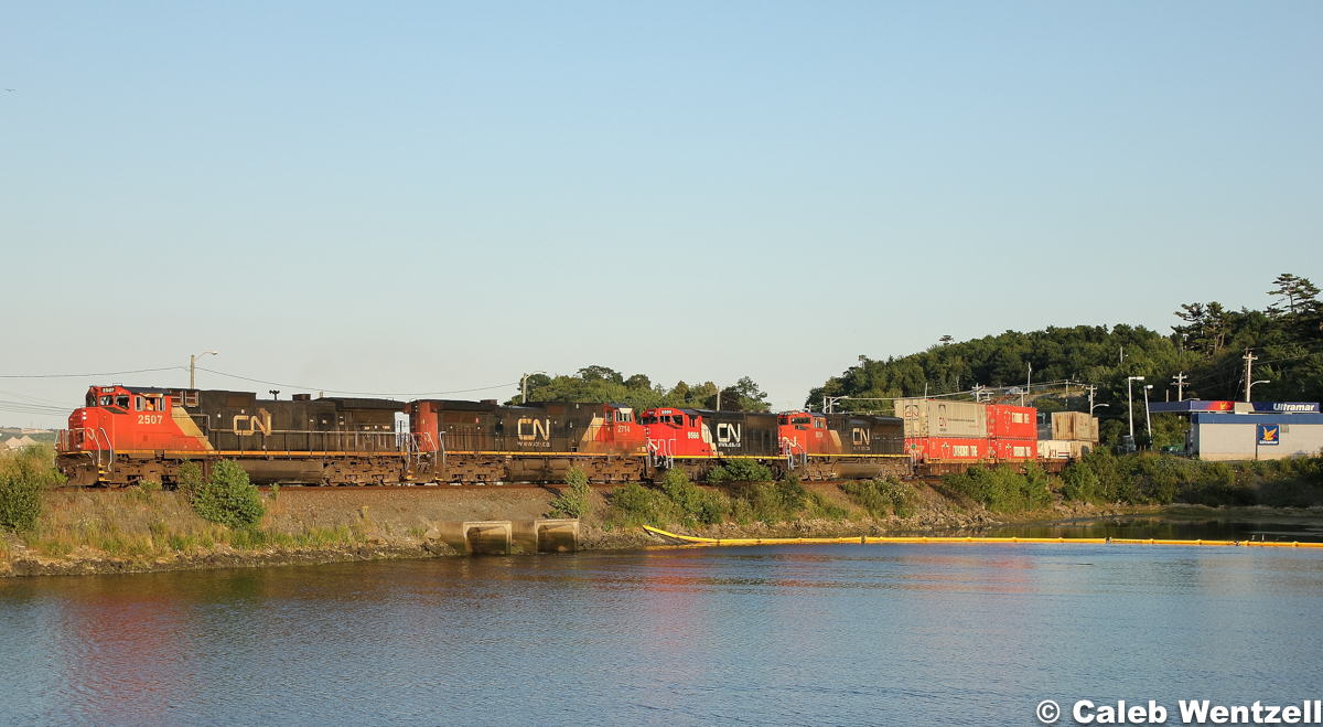 CN 2507 shoots across the fill over the Moirs Mills Pond leading three other units.  With only 2749 footage of train, only the two units at the head are required to be on-line.