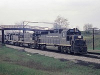 <b> CASO Sub</b> or as it was in 1968, the old Michigan Central.  Here a GP40 leads a hodge lodge of power including a GP30 as it passes under the farm bridge at Clanbrassil, ON.  The bridge and tracks are all a memory now.  