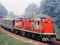 A pair of freshly painted RS-18m Tempo units with Tempo coaches approach Bayview Jct.  The short hoods of these units were extended to house the Head End Power equipment. Interestingly, when these units were converted, they were initially painted in the CN green and gold paint scheme.  They sure looked nice and shiny.  