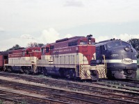 <B>All passenger lineup</B> TH&B 401 and 403 with NYC 4061 rest at the TH&B's Chatham St. roundhouse. The 401 and 403 represent 2/3 of the TH&B GP9's equipped for passenger service.  
