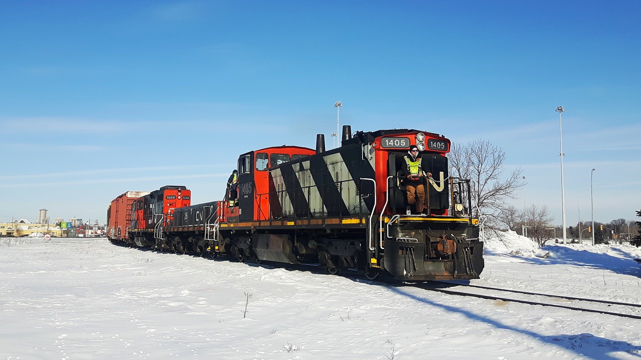 A relatively rare sight as CN 1405, 268 and 7268 haul a local freight south on the CN Letellier Subdivision at Portage Junction. These GMD1's are slowly becoming less and less common, so I'm grateful to be able to see this one still operating in February 2017. They are heading to the Chevrier Industrial to switch out some industries.