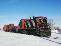 A relatively rare sight as CN 1405, 268 and 7268 haul a local freight south on the CN Letellier Subdivision at Portage Junction. These GMD1's are slowly becoming less and less common, so I'm grateful to be able to see this one still operating in February 2017. They are heading to the Chevrier Industrial to switch out some industries.