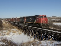 Fort MacMurray to Edmonton freight L556 crosses over a low wooden trestle near Redwater Alberta