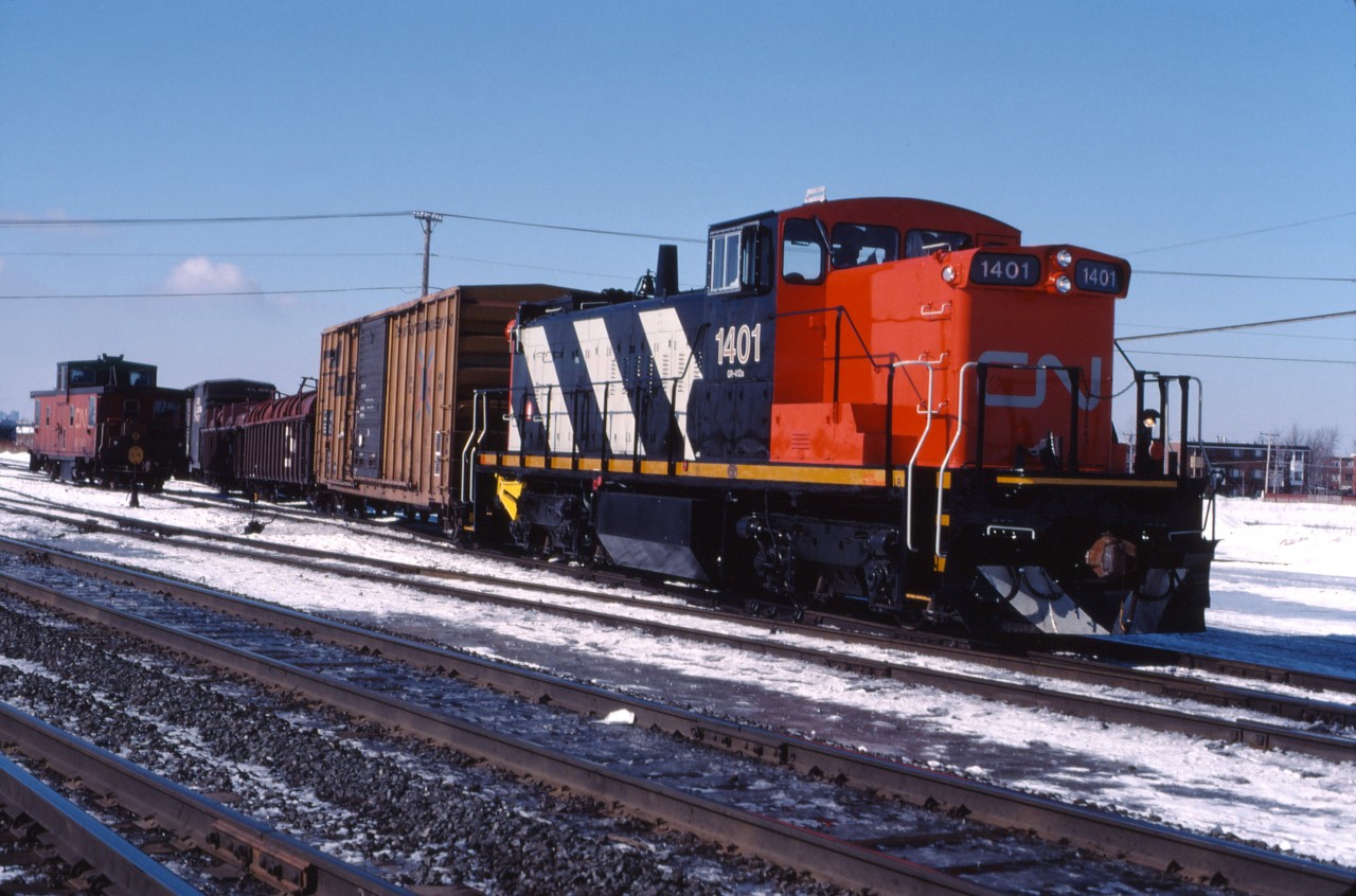 Shortly after being rebuilt from the 1916 at Pte. St. Charles shops, CN 1401 works Southwark Yard. Many of the rebuilt GMD1s were tested on assignments in Ontario and Quebec prior to being assigned to service in Western Canada.

While many GMD1s have been stored, the 1401 was/is still on CN's roster according to the 2016 Canadian Trackside Guide.