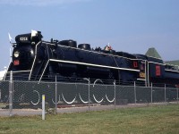 Black paint, white flags and brass bell gleaming in the sun, Canadian National U2g Northern 6218 sits proudly on display in Fort Erie in August of 1980, after her donation to the town in 1973 by CN.