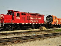 Remote yard mother/daughter push pull consist. GP9u and SW900 slug set parked at the east end of the shop tracks with the 1013 being originally built as CP 6705 in 1955.