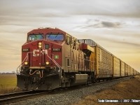 <b> HAPPY FAMILY DAY! </b> As luck would have it, I had just slowly crossed the CP on Jeanette's Creek Rd., hoping to find some action. As luck would have it, way down the line to the west, I saw the headlights of 8801 coming around the bend out of Tilbury. Here, a long string of autoracks are behind 8801 as she makes her way east.