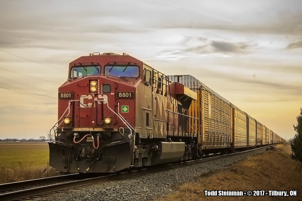 HAPPY FAMILY DAY!  As luck would have it, I had just slowly crossed the CP on Jeanette's Creek Rd., hoping to find some action. As luck would have it, way down the line to the west, I saw the headlights of 8801 coming around the bend out of Tilbury. Here, a long string of autoracks are behind 8801 as she makes her way east.