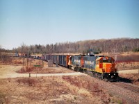 Where? Larocque. Well, I had never heard of it either, but the beauty of these modern day maps is I no longer have to dig out the old topographical maps to find where I have been or where I am going. They still accompany me on trips though. (I had marked this image at being shot at 'Clute') This is the ONR "Little Bear" on its way to Moosonee with the standard mixed train. Some of you 'Northern guys' are no doubt very familiar with this location, Glackmeyer Con 6-7 as indicated on the sign, one of the last decent shooting spots before the train is into the wilderness. Its a longer train than I expected, unfortunately, which leaves the coaches and the flats carrying autos and equipment mostly out of sight in this photo. Power up front is ONR 1809, 1804.