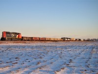 CN 5704 leads train 438 up the Pelton Spur with 21 cars on their way to London. 