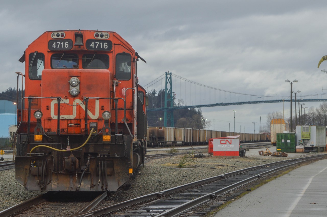 With the crew on lunch, a pair of EMD yard engines sit in the former BC Rail North Vancouver yards, though the sign in the background wants you to know that it is now CN McLean Yard.