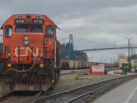 With the crew on lunch, a pair of EMD yard engines sit in the former BC Rail North Vancouver yards, though the sign in the background wants you to know that it is now CN McLean Yard. 