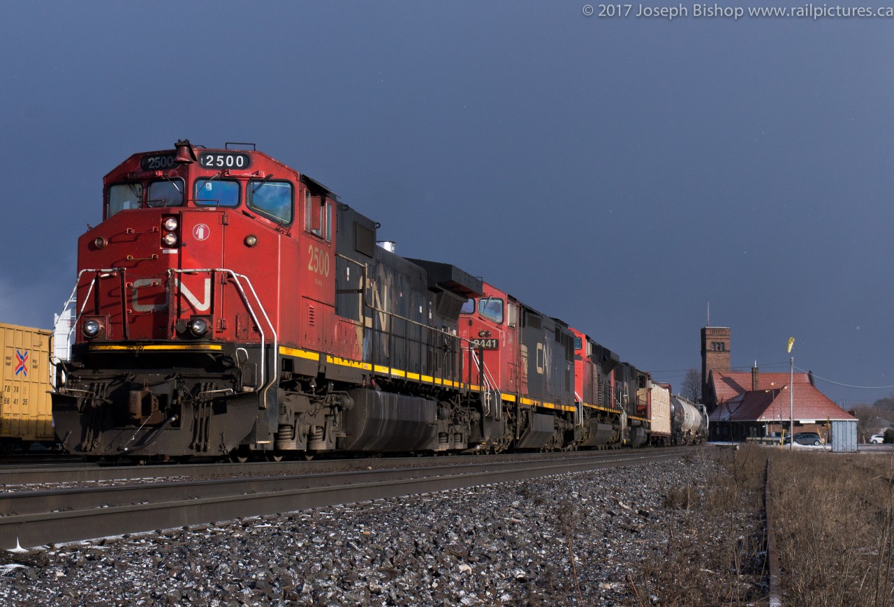 CN 435 is pictured stopped down at the West end of the Brantford yard on the North Track with CN 2500, CN 2441, CN 8962 and CN 5711.  435 was waiting for RLHH 598 to move out of their way so that they could begin their work...598 had a long day yesterday.  They arrived in Brantford shortly after 9 to work Ingenia with RLHH 2081 and 6 hoppers, at 1500 they were still on the Burford Spur waiting for the CN DI to take them back up to Brantford yard.  When they finally received their signal and got back into the yard the crew tied down their cars on BA51 and their locomotive on BA52, these were the tracks that 435 required to drop off their 30 plus cars.  So after some running around to find the SOR crew and a locomotive and cars being relocated 435 was able to complete their work.  The crew was none too pleased but their waiting for SOR allowed me to get sun after a heavy snow squall!