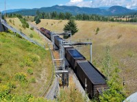 CP 9761 leads a westbound coal train through the sprayers at Carlin. The chemical foam applied is of course for dust suppression, and this location was chosen as roughly midway between Alberta point of origin and the ports of Vancouver.