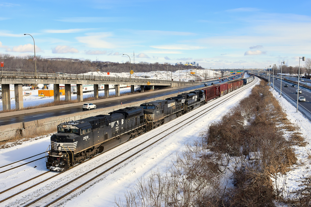 A longer than usual CN 529 is almost finished its run from Rouses Point as it heads west on CN's Montreal Sub with NS 2691, NS 9553 & NS 1101 leading 80 cars. This shot will not be doable for much longer, as CN's tracks here will move to a new ROW a bit further north, probably before the end of 2017.