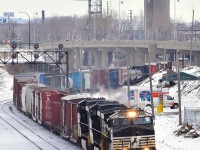 A trio of Dash9's (NS 9944, NS 9935 & NS 9679) lead a short CN 529 through a curve in Montreal West.