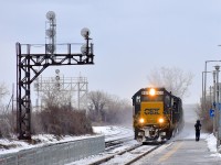 An ex-Seaboard SD50 (CSXT 8525) leads the daily CSX run-through train (CN 327) by the platform at VIA's Dorval Station. Out of sight is trailing unit CSXT 8774, an ex-Conrail SD60I.