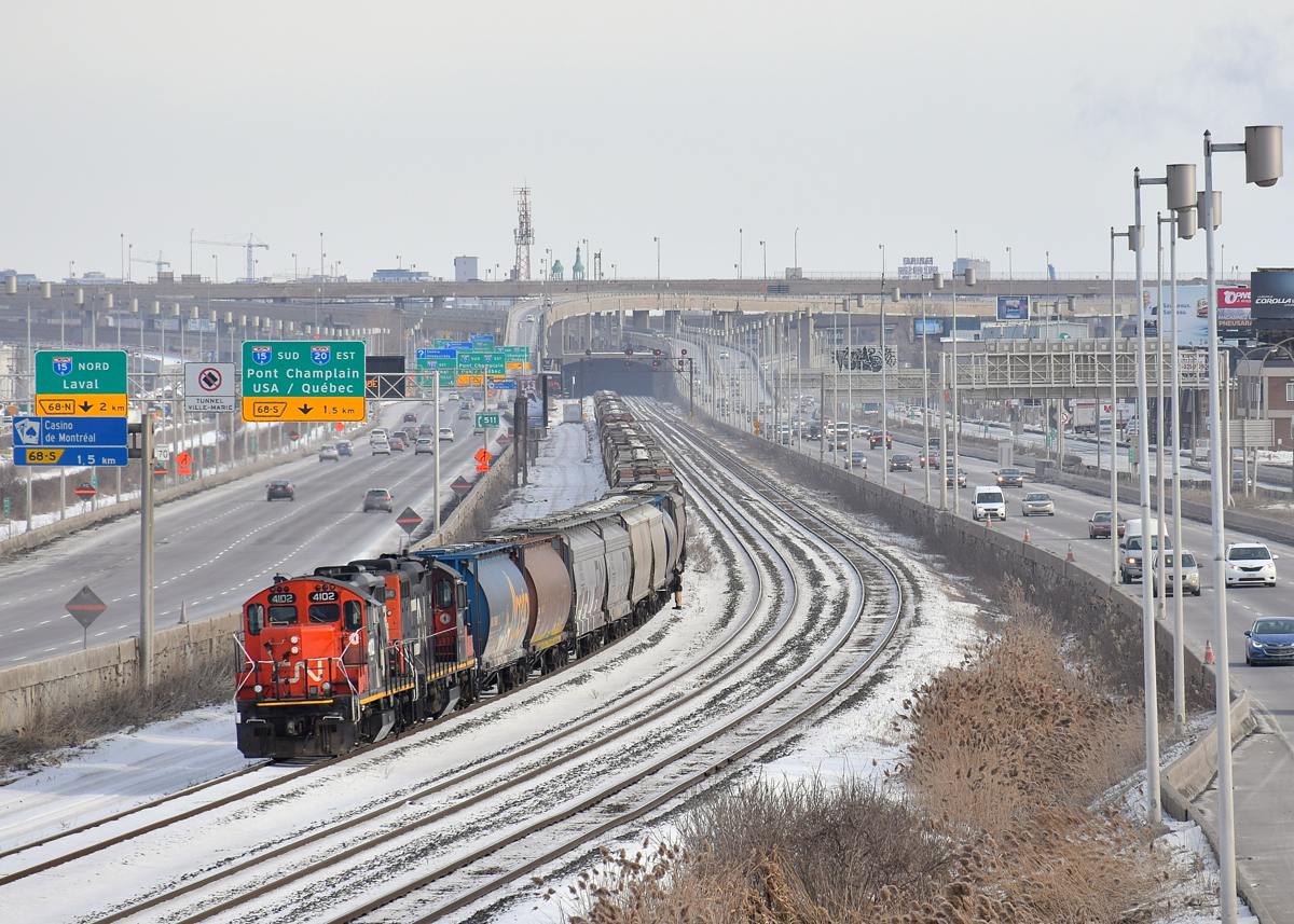 GP9's CN 4102 & CN 7054 have just shoved 7 loaded grain cars onto a cut of empty grain cars on the freight track of CN's Montreal Sub. After, the power will run around the train and it will head to Southwark Yard. Eventually CN X321 will bring them all to Toronto, the loaded grain cars are for GEXR and came to Montreal by mistake on CN 874.