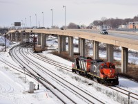 GP9's CN 7054 & CN 4102 are awaiting a signal at Turcot West before they can head west, cross over from the freight to the north track and run around their train of grain cars.