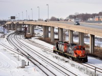 GP9's CN 7054 & CN 4102 are awaiting a signal at Turcot West before they can head west, cross over from the freight to the north track and run around their train of grain cars.