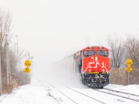 Loaded potash train CN B730 is crossing from the south track to the north track at Dorval on a snowy day, though with the train kicking up so much snow you can't really tell. Brand new ES44AC CN 2981 and ET44AC CN 3057 are up front and ES44AC CN 2806 & ET44AC CN 3068 are mid-train DPU's on this 205-car long train.