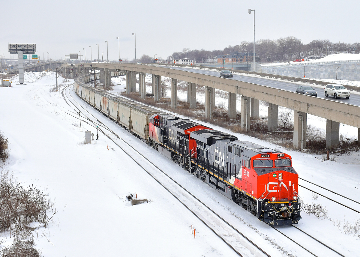 CN B730 with 205 potash loads for St. John, New Brunswick is leaving Turcot West in Montreal after getting a new crew to take it to Joffre Yard. Power is brand new ES44AC CN 2981 and ET44AC CN 3057 up front and ES44AC CN 2806 & ET44AC CN 3068 as mid-train DPU's.