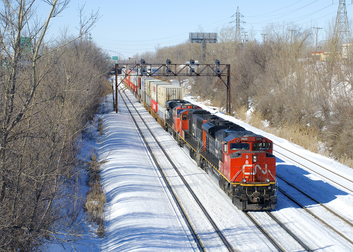 Following an overnight run from Toronto, CN 120 is leaving Taschereau Yard in Montreal this morning after working the yard. It will be in Halifax about 24 hours later, with CN 8806, CN 5778 & CN 2279 up front and CN 8950 mid-train.