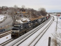 After doing a big lift at Pointe St-Charles Yard, CN 527 is en route for Taschereau Yard as it heads west through Montreal West. This train is amply powered, with seven 6-axle units (NS 9765, NS 7665, NS 7305, CN 5785, CN 2547, CN 2002 & CN 5777). The three NS units came from the previous day's CN 529 (which terminated at Southwark Yard, where CN 527 originates) whereas the the four CN units came from grain train CN 878; those 4 units were part of the pickup at Pointe St-Charles.