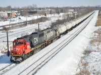 CN 585 the St-Romuald, QC to Maitland, ON Ultra-Train with its cargo of gasoline heads west through Pointe-Claire on a warm winter afternnoon.