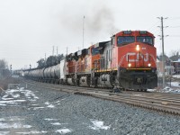 Like the old days, CN M394 once again has BNSF power as it passes CN Norval. Great change is to come once a third track is put in place. This shot may no longer be possible in the near future...