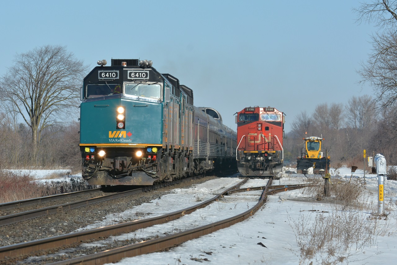 Running block to block with CN M302, VIA #2, "The Canadian", passes tied down A450 in the Pine Orchard siding