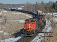 A block in head of VIA #2, CN 8851 leads southbound freight M302 in what possibly could be be the last snow as the temperatures begin to rise. To see Steve's shot of the Canadian from this location click here <a href="http://www.railpictures.ca/?attachment_id=28417"> http://www.railpictures.ca/?attachment_id=28417 </a>