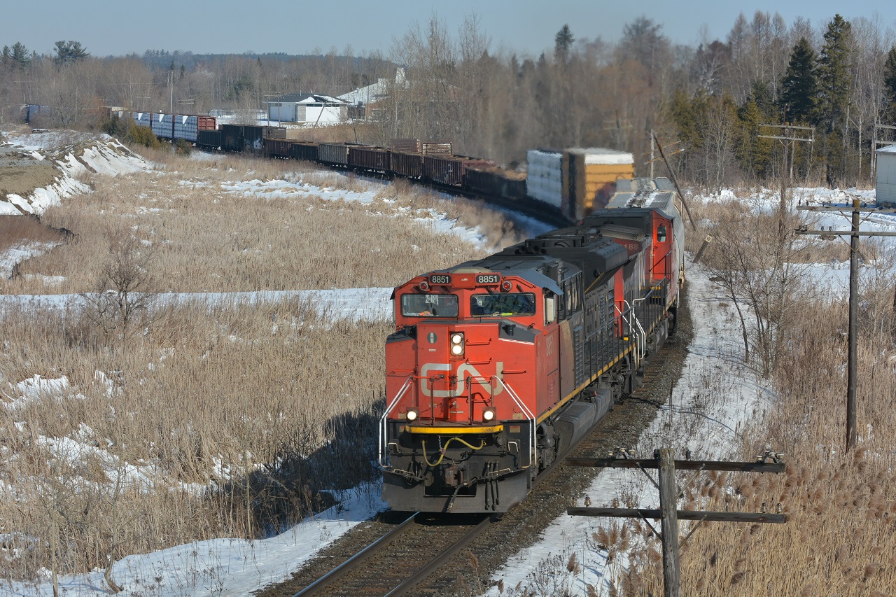 A block in head of VIA #2, CN 8851 leads southbound freight M302 in what possibly could be be the last snow as the temperatures begin to rise. To see Steve's shot of the Canadian from this location click here  http://www.railpictures.ca/?attachment_id=28417