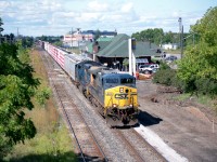 As I post this I am wondering how many guys caught it roaring thru Niagara. There were a few detour trains around that time, maybe half dozen overall; but this is the only one I know of powered by CSX. Three others I saw had NS up front. The detour was caused by heavy rain and resulting flooding and washouts on the upper section of the D&H below Montreal. This is actually a CN train, Montreal to Rouses Pt, often powered by NS/CP. Due to the track being out, it ran around Lake Ontario and over toward Binghamton, creating an unusual opportunity to catch something other than CN thru Niagara. Power is CSX 371 and 4715, as seen rolling past the VIA station. Out of sight behind the power the new platform was being installed, as well as some cosmetic improvements, for the start up of GO Transit to Niagara.