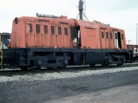 The former Dofasco 6, a 65-ton Whitcomb centre-cab switcher, is seen stored at CN's Fort Erie yard on April 30th 1987.<br><br>According to Ray Kennedy's <a href=http://www.trainweb.org/oldtimetrains/industrial/ont/dofasco.htm><b>Old Time Trains </b></a> page, this unit was one of five ex-US Army Whitcomb 65-ton switchers acquired after World War Two for switching Dofasco's internal trackage at their Hamilton plant. The last operable unit, it suffered an engine failure and was stored out of service in 1969. It was eventually moved to CN's Fort Erie yards where it was stored for many years earmarked for preservation, but ultimately destroyed by arson.