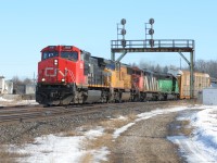 Train 397 with CN Dash 9-44CW 2685, UP SD70M 4087, Dash 8-40CM 2421 and CEFX 7111 is seen curving under the signals in Paris, Ontario. 
