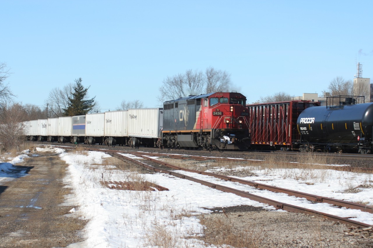 Following behind VIA #72, CN Dash 8-40CM 2436, still wearing its CNNA paint scheme, single handily hauls train 144 through Brantford, Ontario on February 24, 2007.