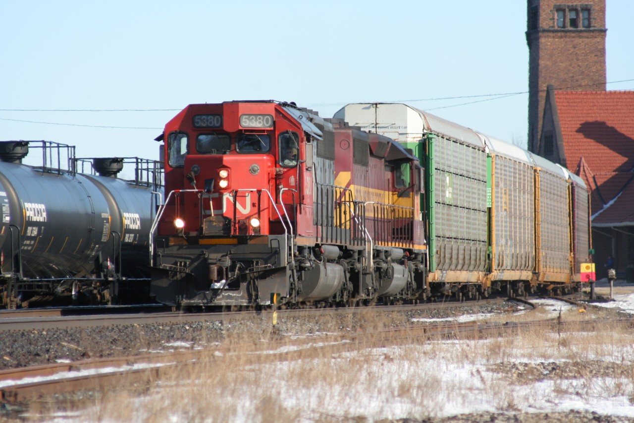 With 385 hot on their tail-end, train 279 with SD40-2 5380 and WC SD40-2 6003 is pictured curving through Brantford, Ontario on February 24, 2007. CN SD40-2 5380 originally started life as Missouri Pacific Railroad 799 while WC SD40-2 6003 was built by GMD in London, Ontario for the Algoma Central during 1973 and numbered 185.