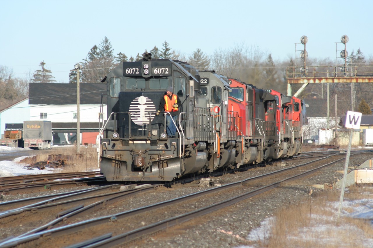 The power on CN train 398 is seen returning to its train at Paris, Ontario on February 24, 2007. The consist includes; Dash 9-44CW’s 2610, 2581, SD40-2 5379, SD75I 5667, WC SD40-3 6922 and IC SD40-2 6072. Built in 1979 by EMD for MKT and originally numbered 613, the venerable SD40-2 was acquired by IC from National Railway Equipment during 1997.
