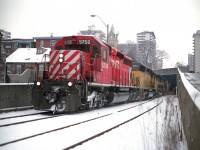 Not the easiest place to shoot. A small stepladder would be much more helpful. I'm leaning a bit over the wall in order to capture CP's #246 on its' way to Welland (and beyond) from Toronto with its colourful head end power....CP 5750, CITX 2796, ICE 6457 and CP 5917. Nice too, that the SD40-2 are making the news as of late, some coming out of hiding now that EHH has left for CSX. :o) This view is just a few hundred yards north of the gorgeous old TH&B station. Or metres, or whatever you call it now............