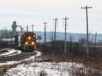 CBNS 3365 leads a train past the Irving owned Sproule lumber in valley heading towards New Glasgow 