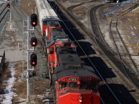 CN's local out of Aldershot is seen backing towards the new plant at Stuart after dropping cars in the SOR Hamilton yard. Today's train has a trio of GP38s up front. The crew will switch the bulk transfer facility in the background next after negotiating the switches at Stewart.