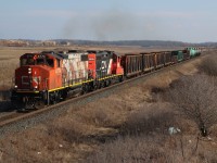 While CN 4774 is in dire need of a new paint job, trailing unit 7255 looks very fresh. It's not very often that 7200 series GP9RMs get to take to the mainline, but since many have been bumped out of yard service they are occasionally assigned to local assignments. The new housing development in south Milton is slowly taking shape in the background, as CN local #551 rolls into town with gondolas for Triple M on the old glass lead and tank cars for Recochem off the main at Mansewood.