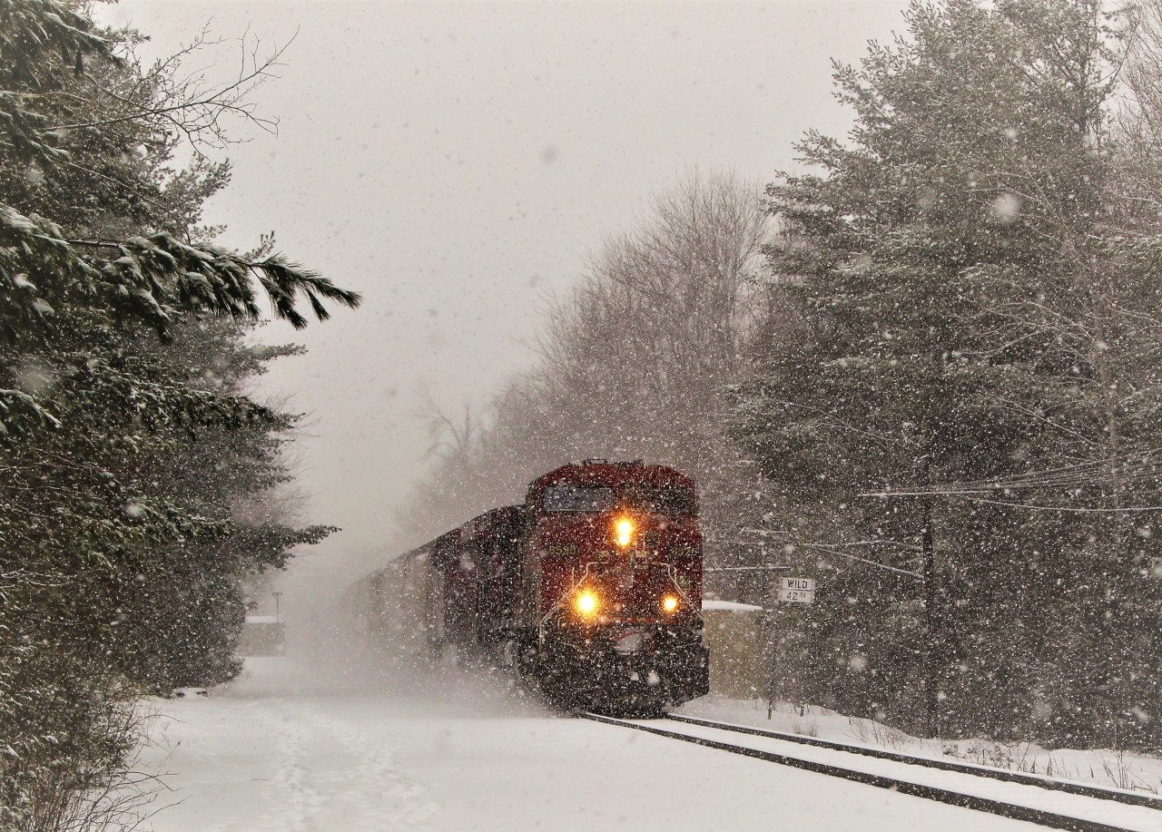 Don't even ask why! But here is CP 240 lead by CP 8525 with CP 9350 tearing through the snow storm past the WILD about to cross the 14th Concession on its way to Guelph Junction.