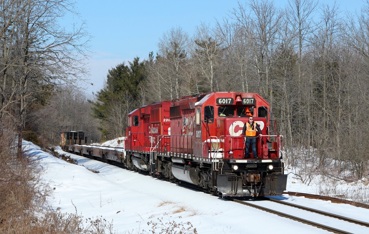 Having just walked in the door and drinking my coffee, on comes the scanner with a clearance to Hamilton's Desjardins. I hear 6017 so I took off for Guelph Junction. For better sun angle I go to one of my favourite spots on the First Line. Around the bend comes SD40-2, 6017 with GP20C-ECO 2285 with the conductor standing on the nose hauling the ballast train. My week has been made.