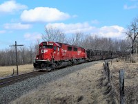 The sun poked out from behind the clouds just in time for the rail track train to roll around the bend with two ex-SOO SD60's for power in CP 6252 and CP 6251 on their way to Orr's lake siding.