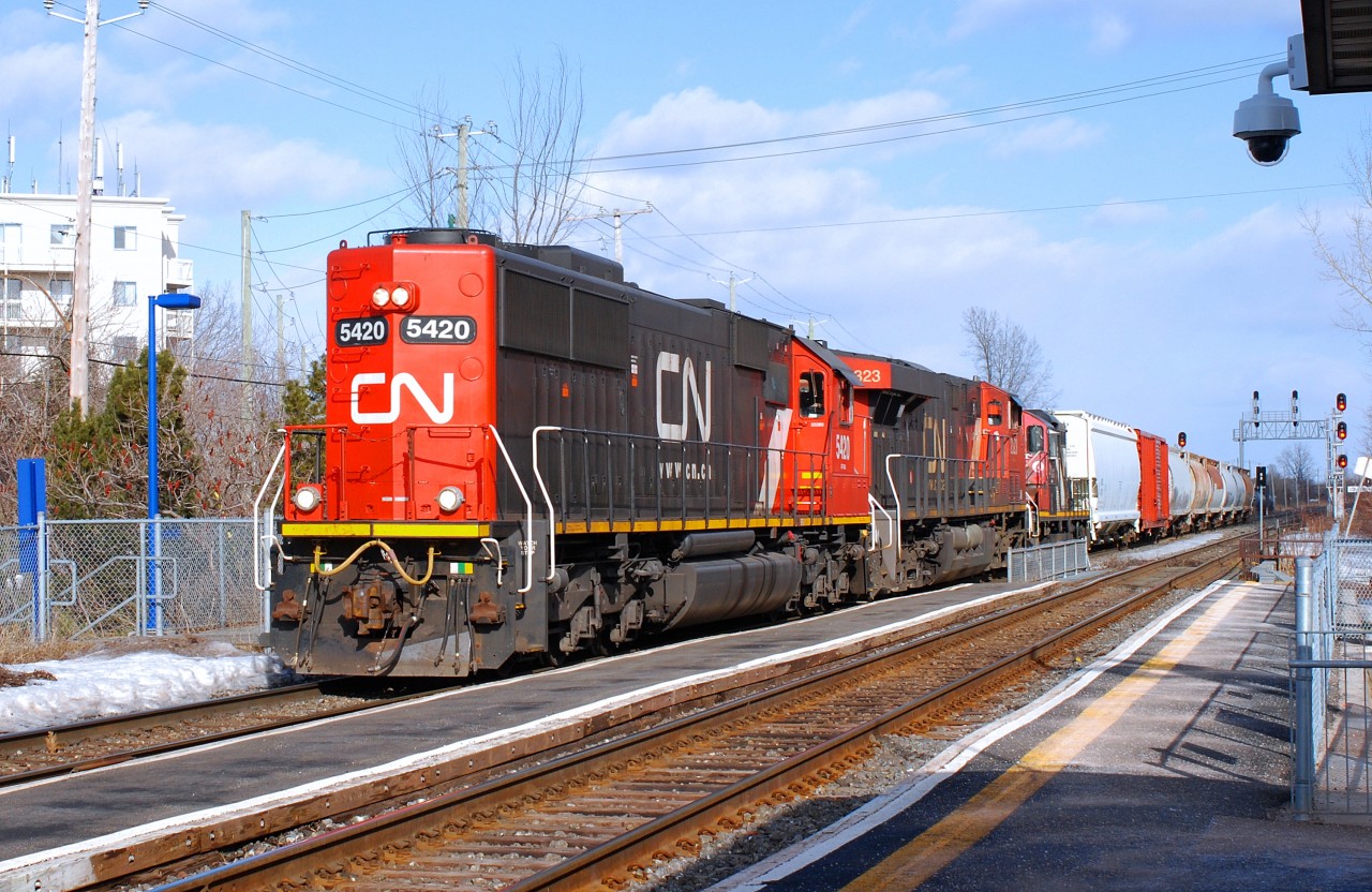 CN-5720 EMD-SD-60  with CN-2323 ES-44-DC also CN-4135 EMD-GP-9 CN-route 527 going to Taschereau yard add to stop on Victoria bridge to try to repair a hose on a car in the back of x321 that have lost is air brake could not repair so the 321 leave the to cars on bridge and 527 have bring the 2cars in Point-St-Charles yard and X321 could leave for Toronto the 2 mains lines block for over a 1 hour