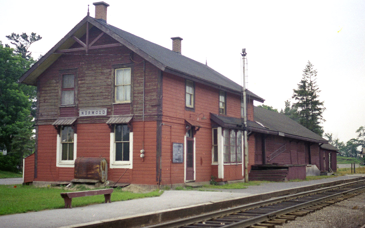 The old long-gone Norwood CP station, a relic from back when the agent/operator lived on the premises. At the time of this photo, the station still served daily CP Budd cars that ran round trip between Peterborough and Toronto.  This is now Kawartha Lakes Railway, a CP internal shortline. Information on the demise of the old station would be appreciated.......