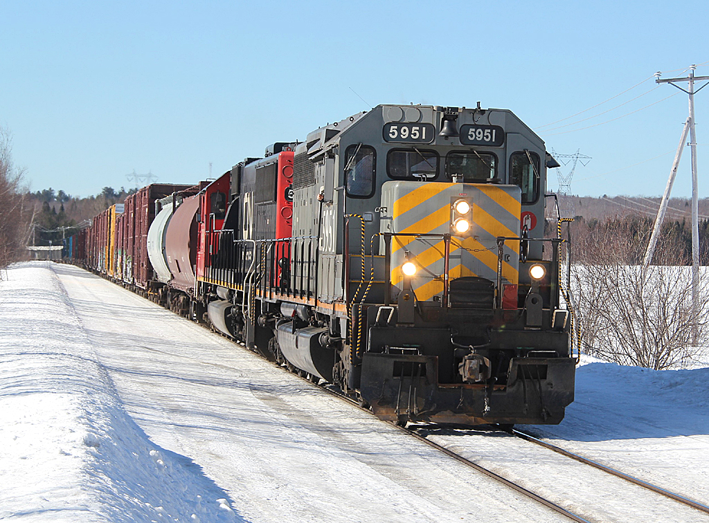 CN 460, with GTW SD40-3 5951, along with CN SD60 5454, is at St Paulin, QC