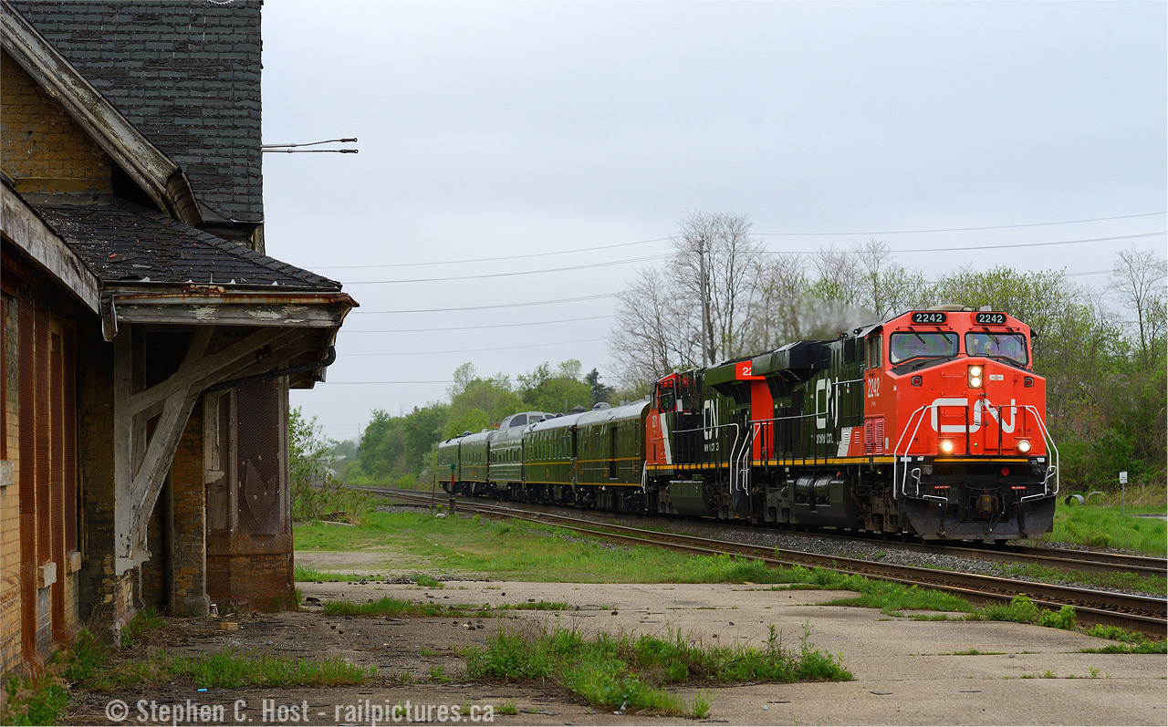 Having known this was coming ex Sarnia - I took a couple hours off work and found the best place I could think of to shoot this. I call this a juxtoposition - The Varnish of the Canadian National Railway passing the derelict Ingersoll station. Thanks to an overcast morning you can clearly see details in the sadly neglected structure including where the semaphores used to be located. There were efforts to preserve this structure about 10 years ago but it could not be done - too close to the bridge at the end of the driveway to safely turn it -  without having to move it over the CNR mainline (and I suppose that's just not going to happen - railways don't like shutdowns anymore!). Given how much time has passed and how further neglected this structure is (the roof  looks like it's made of paper now) any hope it had now rests in fate's hands. The fact it's still standing for this photo, let alone any in 2017 is nothing short of a miracle.
This train , being passenger, ran at Passenger speeds. Chasing was not an option. I just went to work after this photo, as much as I'd love to have shot it again. I seem to recall they re-crewed on the Halton sub somewhere and made it to Montreal arriving around Noon. This photo was taken not long after #70 had detrained passengers at Ingersoll.